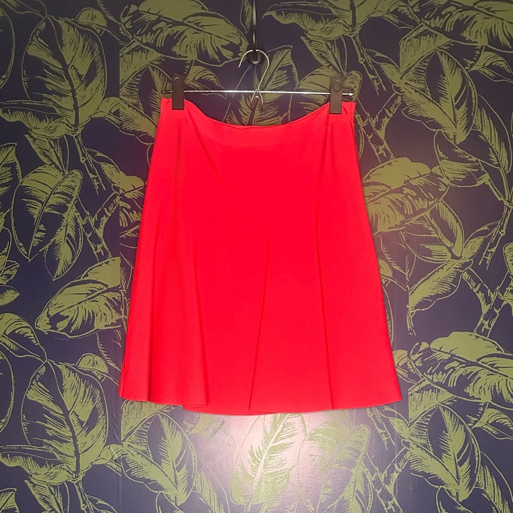 Red BCBG skirt, come to mid thigh-top of knee